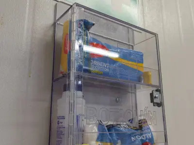 Acrylic first aid cabinet with visible contents