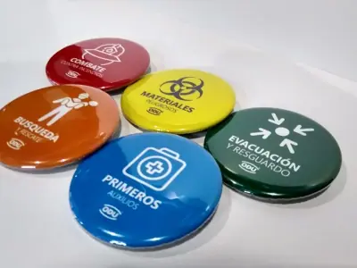 Set of emergency team discs with one pictogram per function: fire, hazmat, evacuation, search and first aid · ODU
