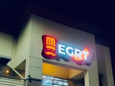 Illuminated storefront facade · EGRT