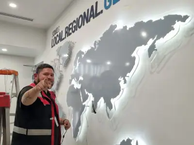 Dimensional world map on an office wall · xpd global