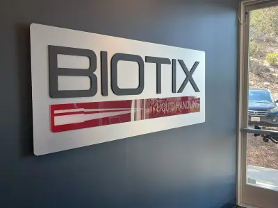 Reception sign in acrylic and vinyl · Biotix