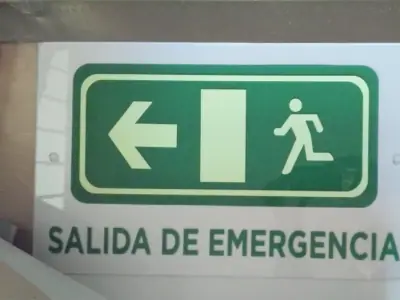 Photoluminescent emergency exit sign