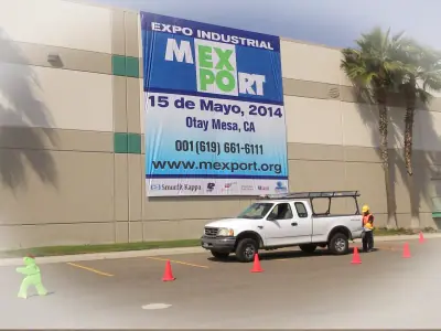 Industrial trade show banner on a facade